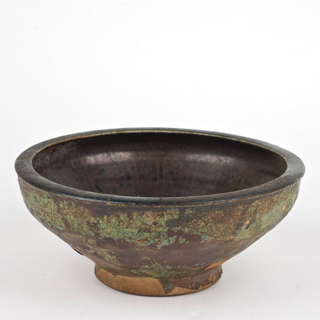 Antique Islamic glazed pottery bowl: Antique Islamic glazed pottery bowl: Prob. 12th/13th c. Kashan, oxidized turquoise and black, 3.5"h x 8"dia. - Condition Report: overall poor, restorations throughout, glaze loss, crazing - Provenance