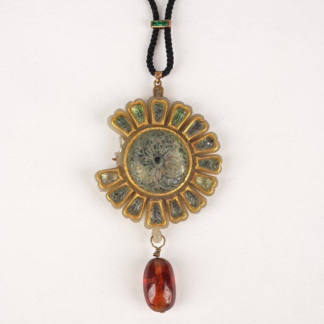 Antique Mughal jade, gold and green gem pendant: Antique Mughal jade, gold and green gem pendant: 19th c. or earlier, of floral form with, finely carved, with amber drop, 1.75"dia. (excl. drop) - Condition Report: overall poor, 2 petals damaged and 