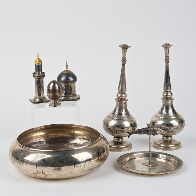 (7) piece Islamic silver niello table set: (7) piece Islamic silver niello table set: 20th c., incl. (2) water sprinklers, (1) bowl, (1) fish dish, and (3) shakers, 2.5"h x 8.25"dia. (bowl), 2.25"h x 1.25"dia. (egg shaker), approx. 42.2 ozt. (