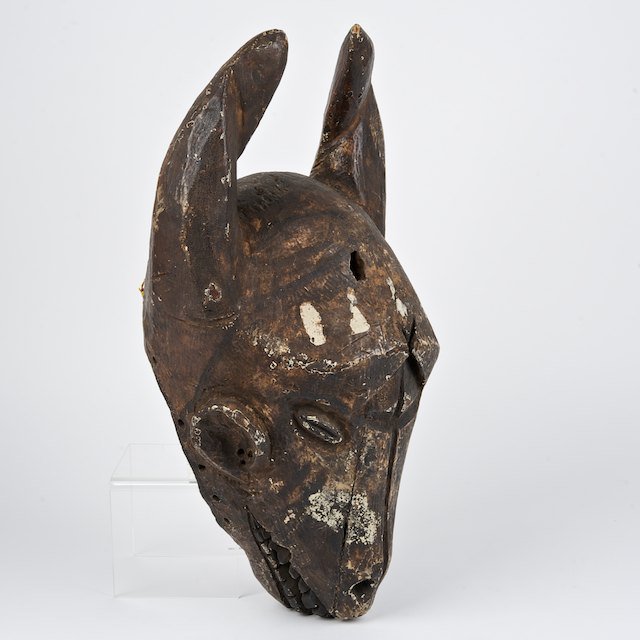 Museum Deaccession: African carved wood ram mask: Museum Deaccession: African carved wood ram mask: Prob. Ibibio, Nigeria, 17.5"h x 10.75"w x 7.5"d - Condition Report: overall fair, insect damage, wood loss, paint loss and distress commensurate with 