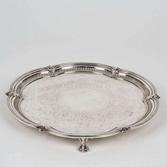 Edwardian sterling silver salver: Edwardian sterling silver salver: Sheffield, circa 1908, maker's mark of Cooper Bros., 10.5"dia., approx. 18.6 ozt. - Condition Report: overall good/fair, surface scratches, dent, polish wear