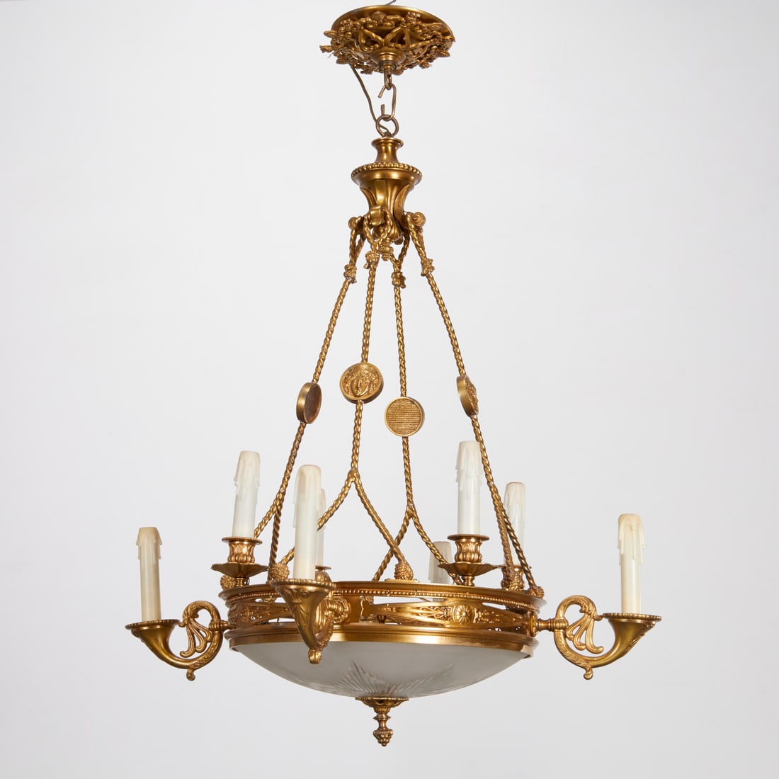 Empire style domed chandelier: Empire style domed chandelier, 20th c., eight light frame, hanging by gilt molded rope twist supports with mask head medallions, with part frosted cut glass domed shade, unmarked, approx. 38"h x 30.5"