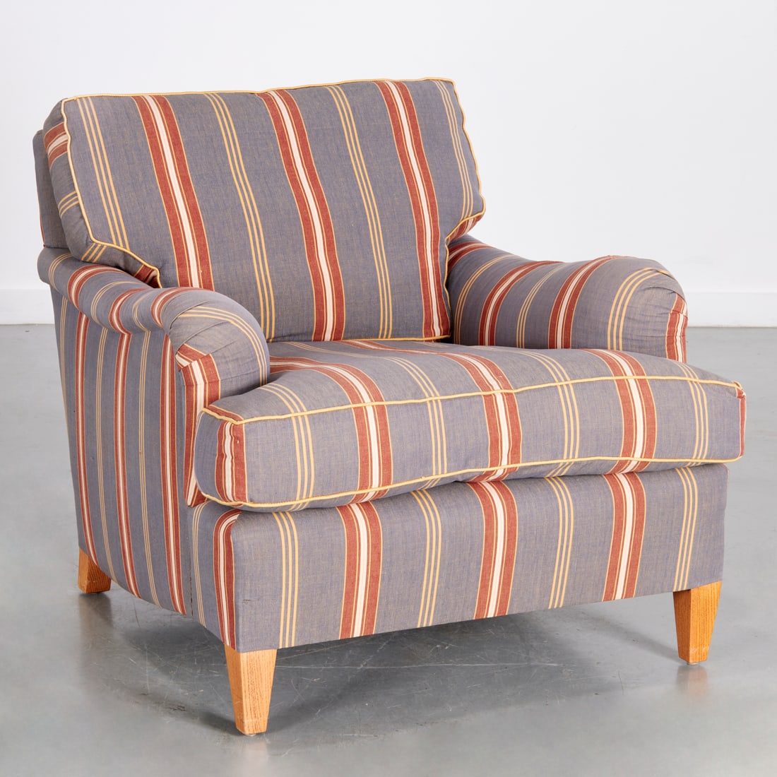 Custom upholstered English arm club chair: Custom upholstered English arm club chair, 20th/21st c., good quality, with deep seat, striped upholstery, oak legs, unmarked, 33"h x 34"w x 40"d Provenance: A Private Collection: 10 East 70th Street,