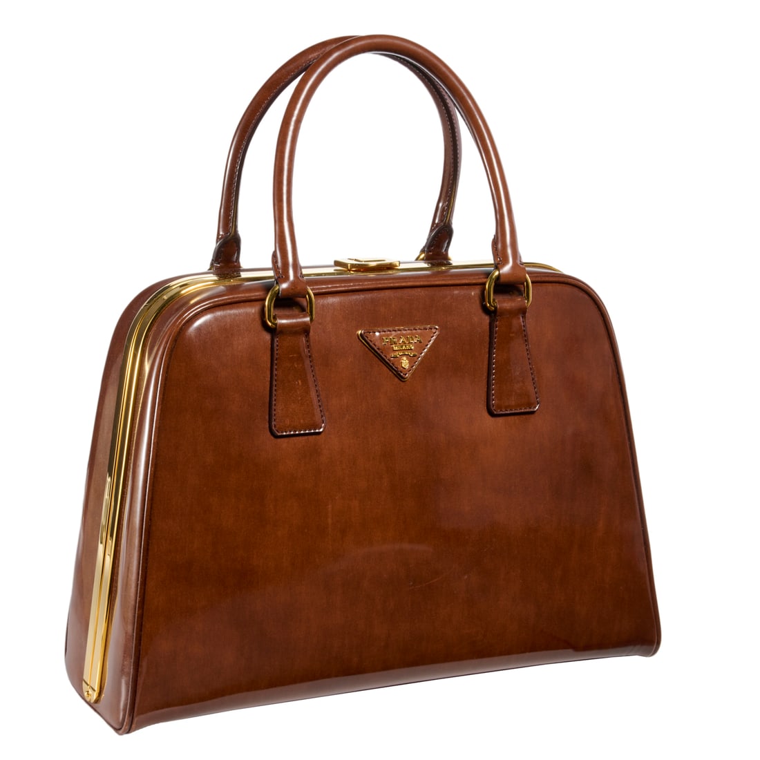 Prada brown patent leather pyramid bag: Prada brown patent leather pyramid bag, 2012, in Tabacco Fume (2) handle, with gold metal details, leather interior with 2 zipper pockets, with COA, approx. 9"h, 13"l Provenance: From an Upper East Si