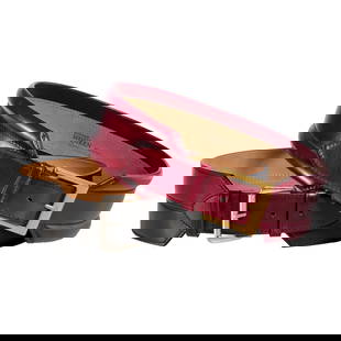 (2) Alexander McQueen leather belts: (2) Alexander McQueen leather belts, 21st c., Made in Italy, size 75 (waist 30"), (1) burgundy red with gold metal buckle, approx. 3"w, 34.5"l total, (1) black with silver metal buckle, 2.75"w, 34.5"l