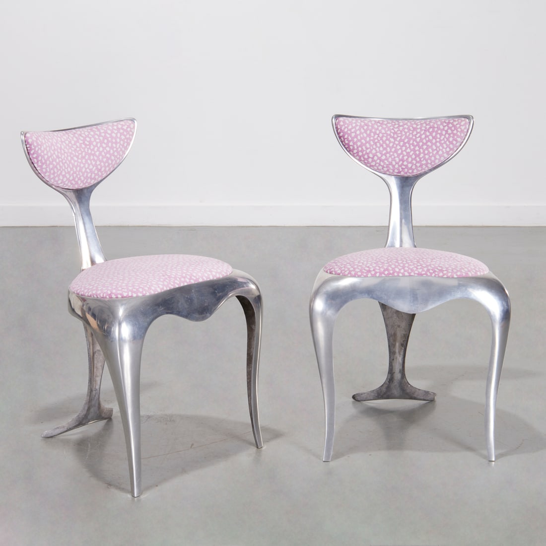 Mark Brazier Jones, pair aluminum "Dolphin" chairs: Mark Brazier Jones, pair aluminum "Dolphin" chairs, c. 1995, England, numbers 59 and 60 from an edition of 200, upholstered in a lavender spotted silk chenille, engraved signature, date and edition nu