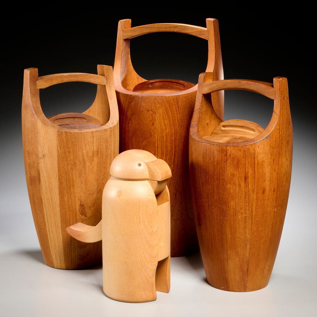 (4) Pieces MCM Scandinavian barware: (4) Pieces MCM Scandinavian barware, 20th c., incl. (1) large and (2) small Jens Quistgaard for Dansk teak ice buckets, and a Goran Warff for Boda Tra penguin nutcracker, each stamped on underside, 19