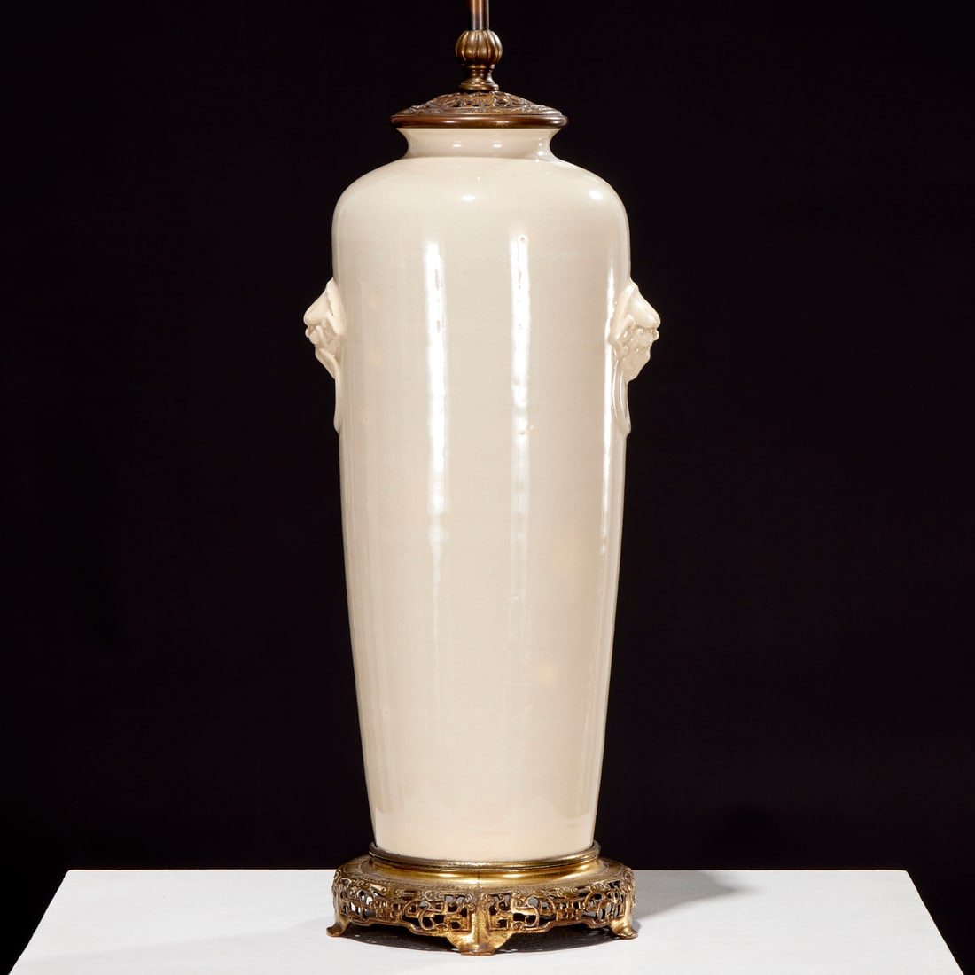Chinese monochrome porcelain vase lamp: Chinese monochrome porcelain vase lamp, 19th/20th c., crackle glaze, with foo beast handles, drilled and mounted as two light lamp, 30.5"x 7.75"w x 6.5"d Provenance: A Private Collection: 75 Central P