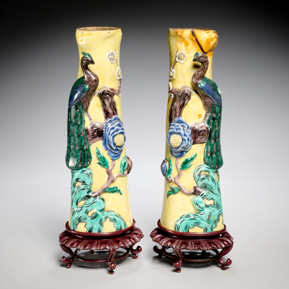 Pair Chinese Famille Jaune porcelain vases: Pair Chinese Famille Jaune porcelain vases, 19th c., peacock relief, carved hardwood stand, each 12"h x 4.5"w x 3.5"d Provenance: A Billy Baldwin Commission: 710 Park Avenue, NYC