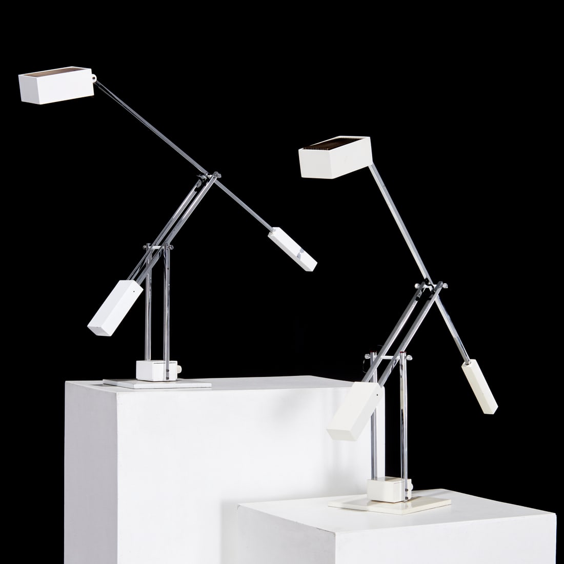 (2) Robert Sonneman counterbalance desk lamps: (2) Robert Sonneman counterbalance desk lamps, c. 1970s/80s, chrome and white enameled metal, swivels on base, no visible marks, 27"h x 7"w x 34"d