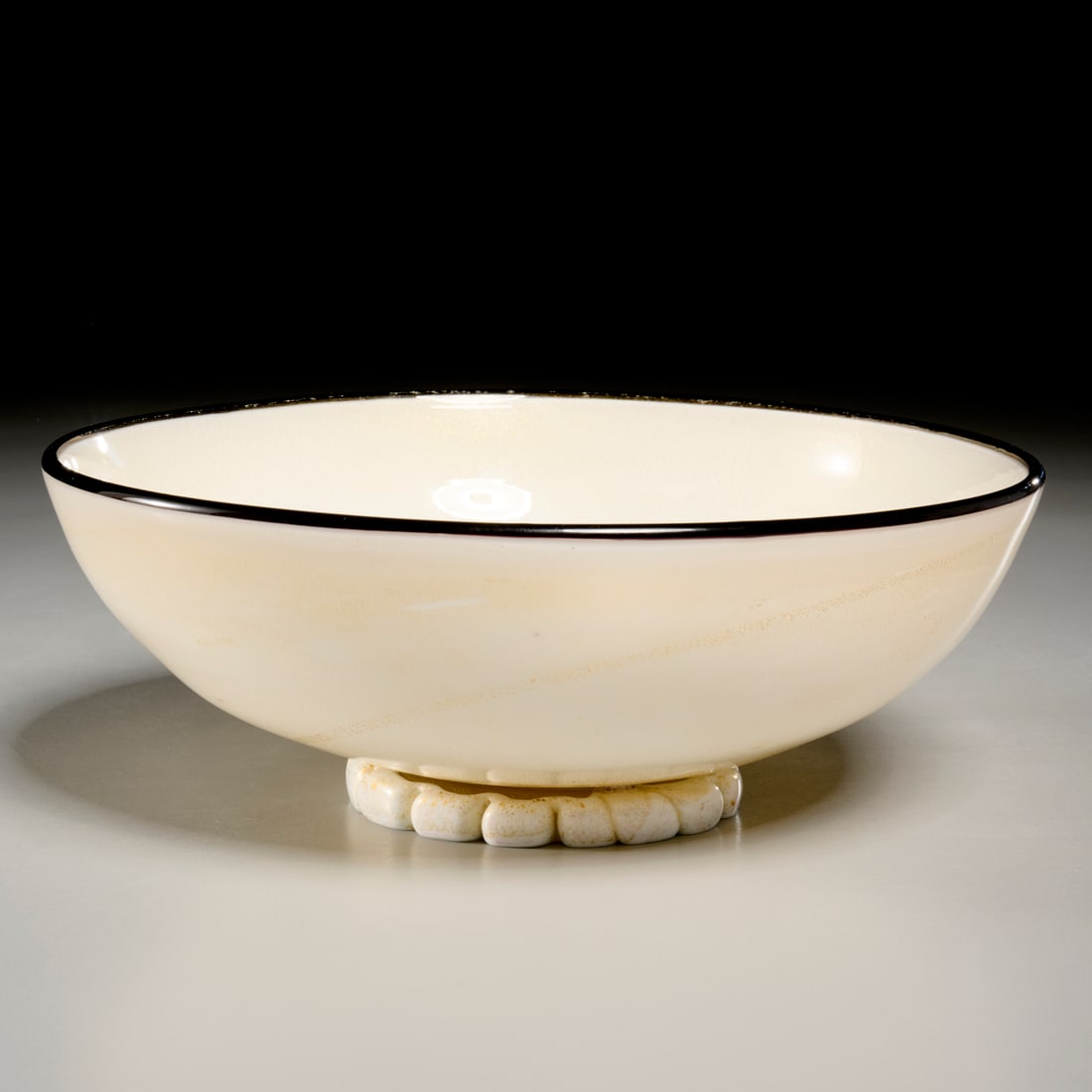 Carlo Scarpa (attrib.) for Pauly & Cie glass bowl: Carlo Scarpa (attrib.) for Pauly & Cie glass bowl, c. 1935, Italy, gold speckled aventurine glass, black pasta di vetro rim, footed, label underside, 3.25"h x 8.5"dia