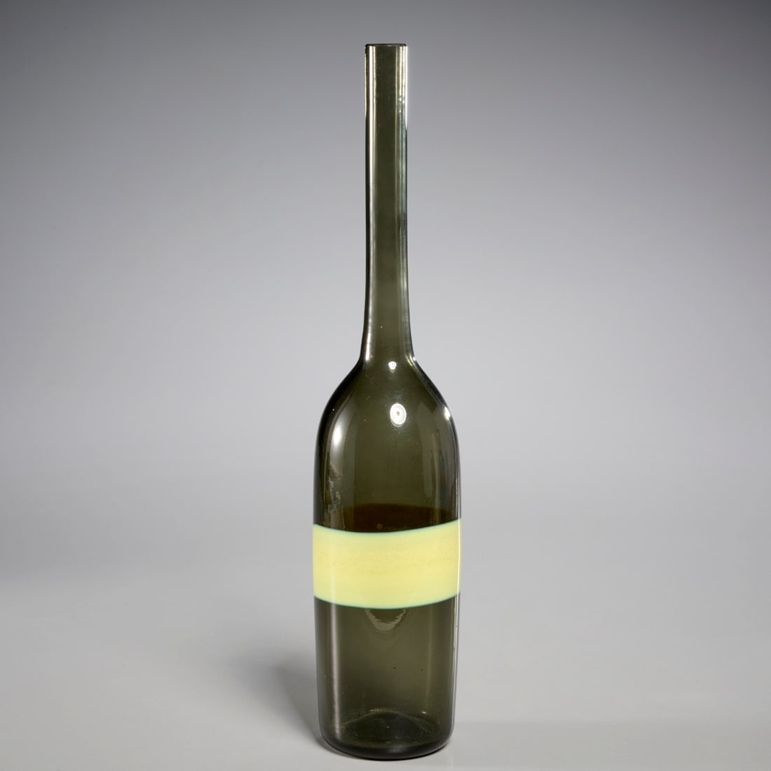 Fulvio Bianconi for Venini, glass "Fasce" bottle: Fulvio Bianconi for Venini, glass "Fasce" bottle, c. 1953, Italy, olive green glass with horizontal yellow band, mark and label underside, 12.5"h x 2.5"dia