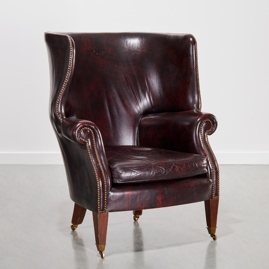 Edwardian leather barrel back wing chair