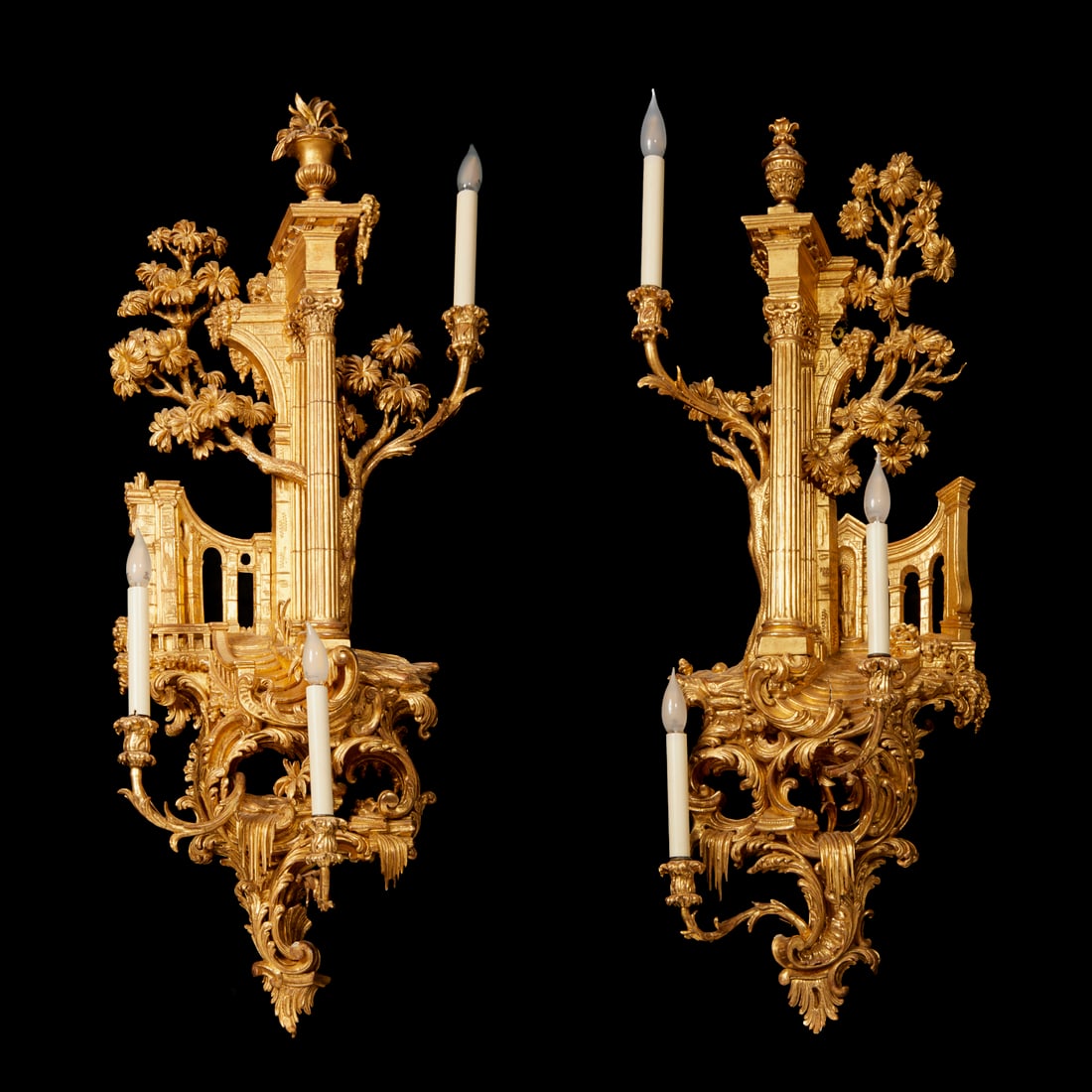 Impressive pair George III style giltwood sconces: Impressive pair George III style giltwood sconces, 19th c., in the manner of Thomas Johnson, each elaborately carved scenic backplate depicting a classical architectural ruin surrounded by leafy trees