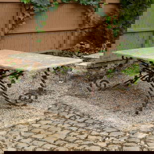 French wrought iron and stone garden table: French wrought iron and stone garden table, Mid 20th c., rectangular stone top with beveled edge on Baroque style twist-and-block base, unmarked, 29"h x 80"w x 40"d Provenance: Property from LuShan Fa