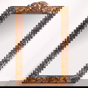 Monumental French repousse bronze and gilt mirror: Monumental French repousse bronze and gilt mirror, Late 19th c., with arched cresting depicting a galleon and hippocamps on gilt stippled ground, above a rectangular plate between classical carved mai