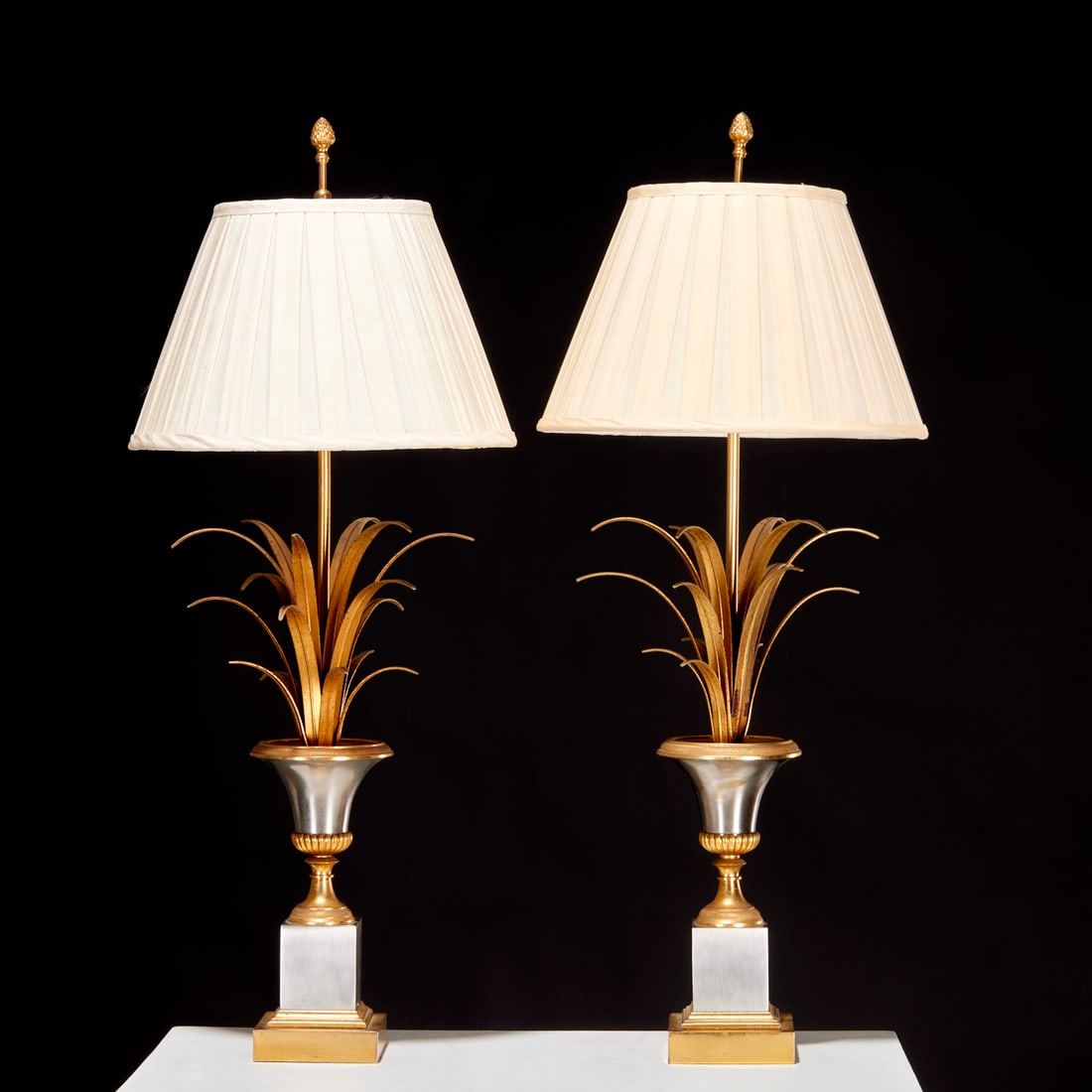 Maison Charles, pair "Vase Roseaux" table lamps: Maison Charles, pair "Vase Roseaux" table lamps, c. 1960s, France, gilt bronze, polished steel base, triple-cluster candelabra sockets, unmarked, with pleated silk shades, each 30"h x 12"dia (total),