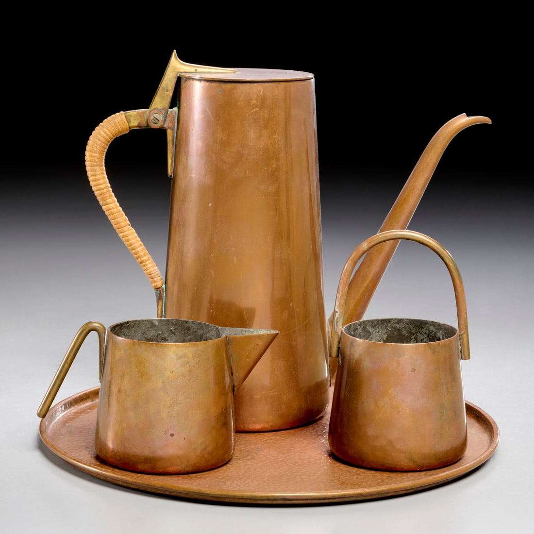 Carl Aubock, coffee service: Carl Aubock, coffee service, c. 1930s, Austria, copper, brass and wrapped cane, incl. a coffee pot, creamer, and open sugar, each stamped on underside, with a complimenting round form copper tray, no