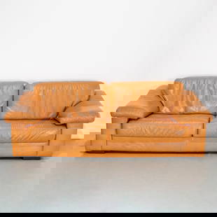 Italian Modern leather sofa: Italian Modern leather sofa, 20th c., loose foam-filled seat and back cushions, raised on wood block feet, 30"h x 88"w x 40"d, 16"h (to seat) Provenance: A Private Collection: 575 Park Avenue & Rye, N