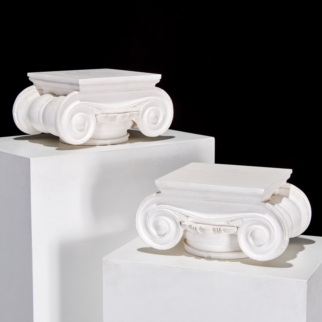 Pair Custom plaster architectural capitals: Pair Custom plaster architectural capitals, 20th c., unmarked, 8"h x 15"w x 9.5"d (each)