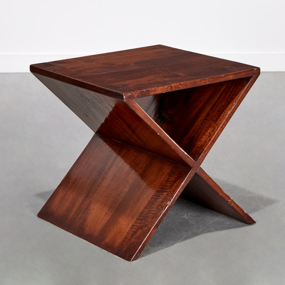 Modernist mahogany end table: Modernist mahogany end table, 20th c., X-form, unmarked, 21"h x 20.75"w x 19.75"d Provenance: A Private Collection: 575 Park Avenue & Rye, NY