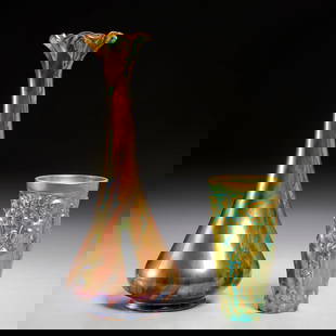 (2) Zsolnay iridescent glaze ceramic vases: (2) Zsolnay iridescent glaze ceramic vases, 20th c., Hungary, incl. a figural relief tumbler and a marbleized design vase with ruffled rim, each stamped on underside, the larger vase numbered "10505 /