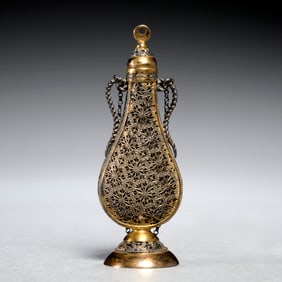 Orientalist pierced silver scent bottle