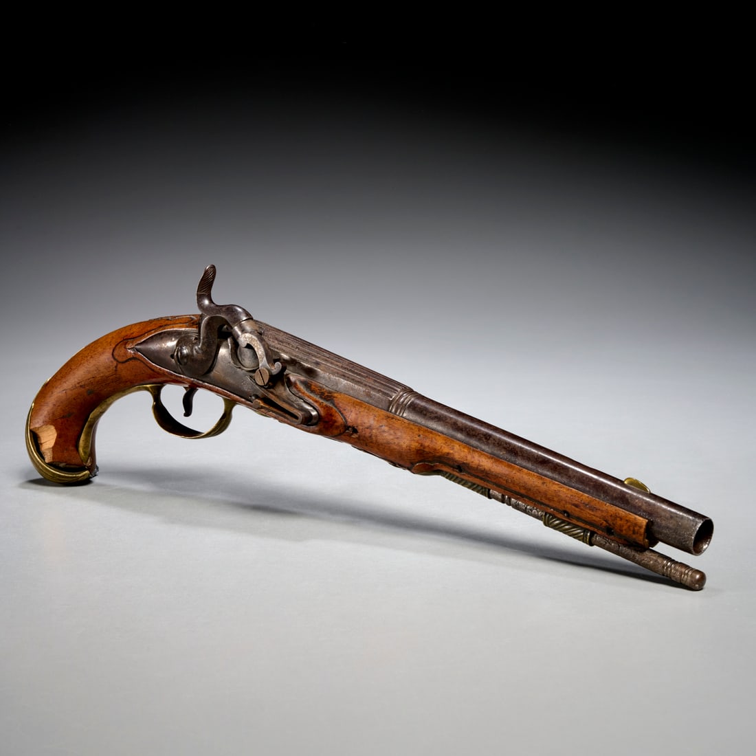 Antique percussion caplock pistol: Antique percussion caplock pistol, 19th c., walnut with carved decoration, steel barrel with brass sight, unmarked, 15"l Provenance: A Private Collection: 575 Park Avenue & Rye, NY