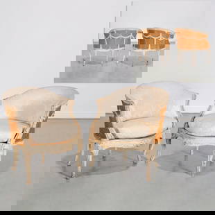 Nice pair Louis XVI style painted caned bergeres: Nice pair Louis XVI style painted caned bergeres, 19th/20th c., carved and cream painted, with drapery swag detail to backs, loose seat cushions, unmarked, 31"h x 28"w x 19"d Provenance: The Iris