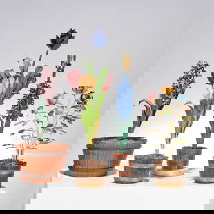 Italian tole peinte potted flower group: Italian tole peinte potted flower group, 19th/20th c., (4) bouquets in barrel style planters, two marked with "Made in Italy" stickers to undersides, one fitted as a lamp and mounted on round white