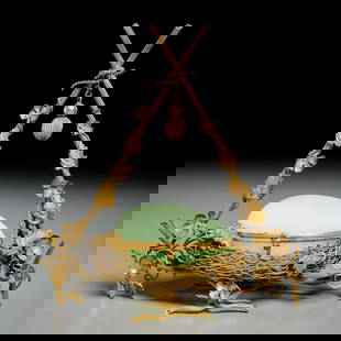 Palais Royal opaline egg box on nest: Palais Royal opaline egg box on nest, Late 19th c., France, hinged light green glass egg box, mounted in gilt metal nest stand, 10.25"h x 9.25"w x 4.5"d Provenance: The Iris Apfel Collection