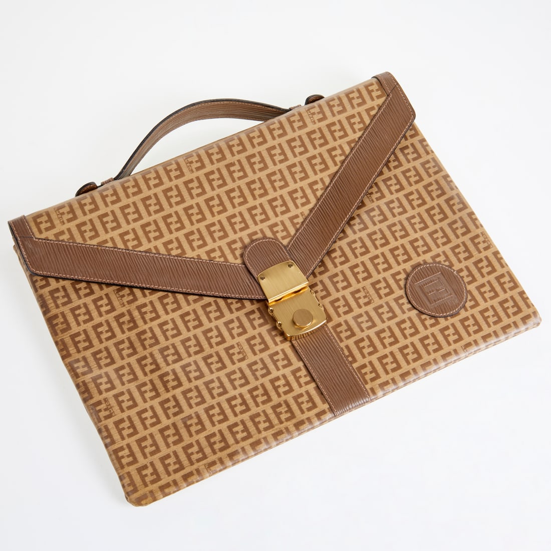 Fendi monogram canvas attache: Fendi monogram canvas attache, 20th c., Made in Italy, single handle, snap closure, divided interior with zipper pockets, logo lining, approx. 11"h, 15"w Provenance: The Iris Apfel Collection