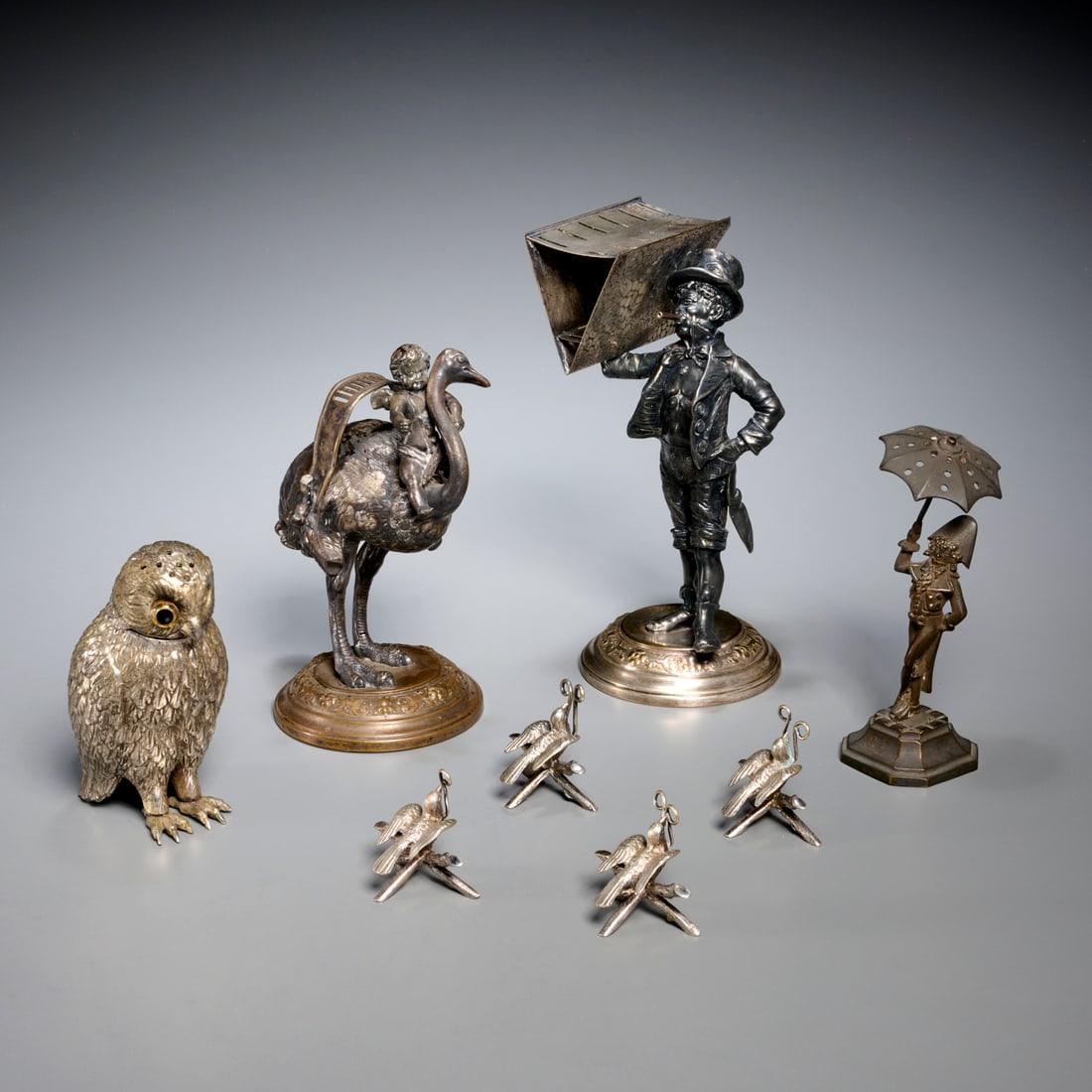 Group Victorian silver plated novelty accessories: Group Victorian silver plated novelty accessories, 19th/20th c., (8) pieces, incl. figural knife and toothpick holders, owl-form shaker, and four bird-on-branch name card holders, 8.5"h x 4.5"l x 4.5"