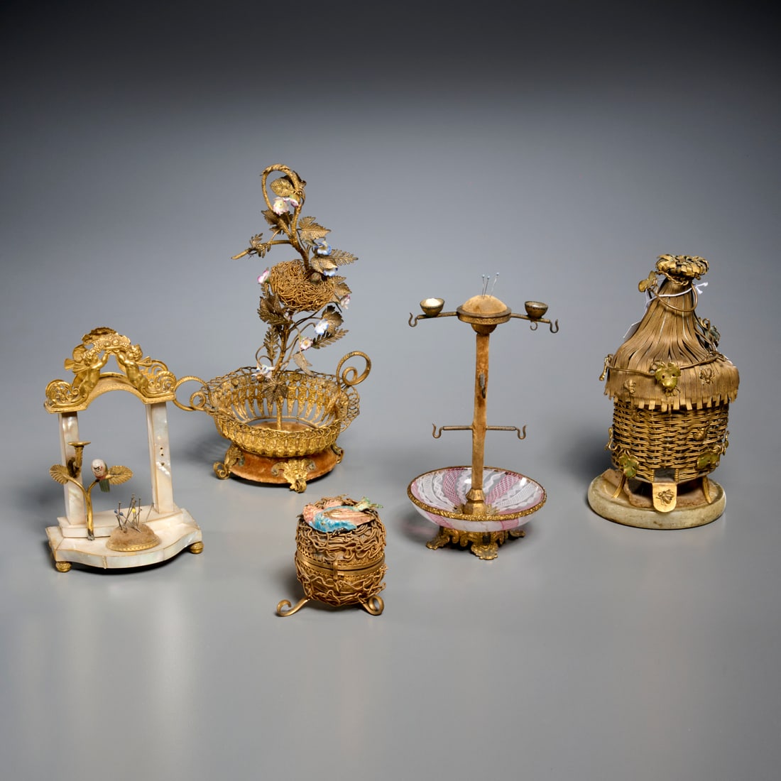 (5) Palais Royal sewing and table accessories: (5) Palais Royal sewing and table accessories, Late 19th/Early 20th c., France, incl. a hinged beehive necessaire fitted with perfume bottle, thimble, and scissor, a Murano latticino glass base sewing