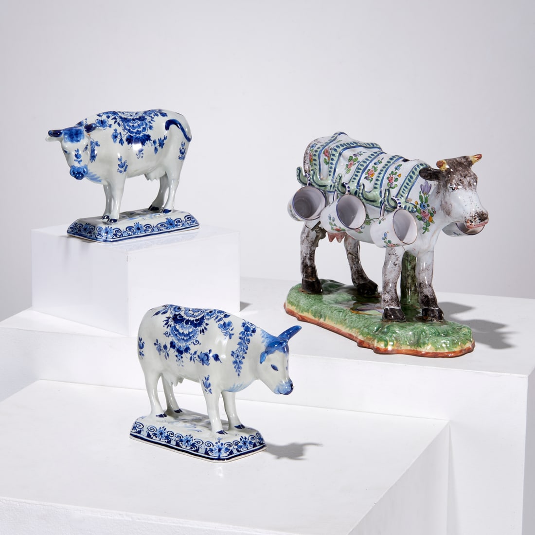 Alfred Renoleau, faience cow creamer: Alfred Renoleau, faience cow creamer, Alfred Renoleau (French, 1854-1930), polychrome glazed, with (5) removable cups, marked "ARA" on underside, 9"h x 14"l x 5"w, with (2) Delft blue and white glazed