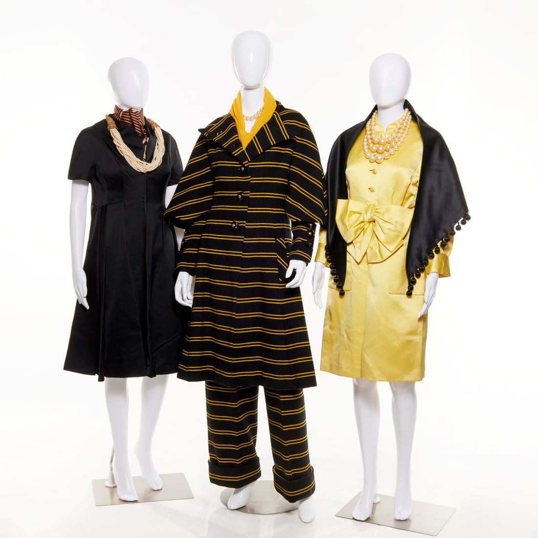 Ronald Amey wool coat, coordinating dresses: Ronald Amey wool coat, coordinating dresses, c. 1970s, black wool with yellow stripes, asymmetrical button closure, unusual bell sleeve with cuffed closure, side pockets, 38"b, 22"sl, 44"l, 19"sh, coo