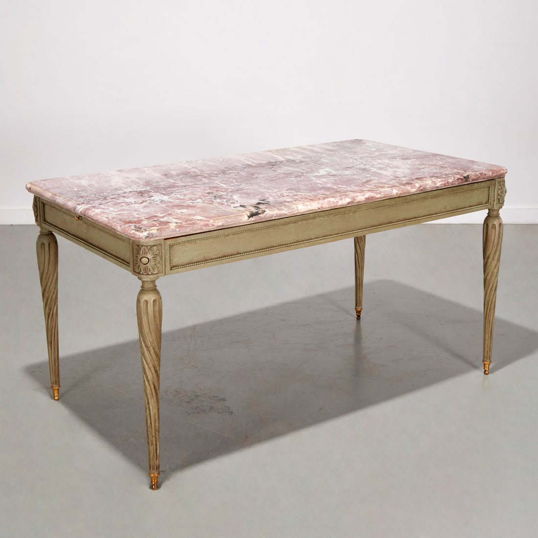 Louis XVI style painted marble top table: Louis XVI style painted marble top table, Third quarter 20th c., variegated pink marble top with molded edge, large frieze drawer to one side, pull out writing surfaces to each end, on spiral fluted l
