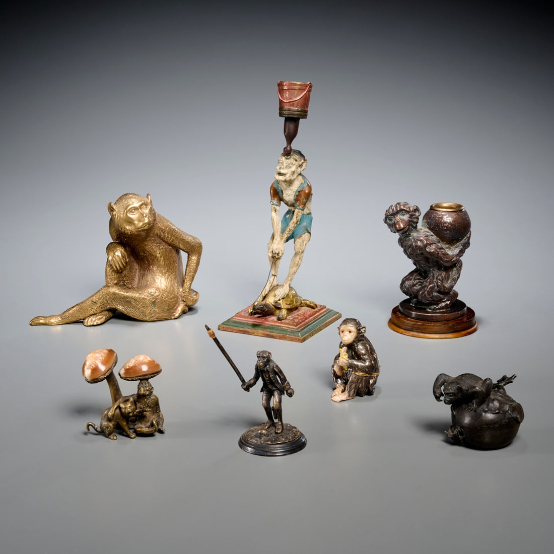 Group antique metalware monkey figures: Group antique metalware monkey figures, 20th c., (7) pieces, incl. assorted candleholders, figures incl. a Japanese example, some miniatures, a Christofle style monkey (possibly a toothpick holder) an