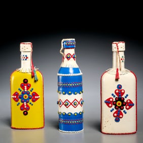 Group (3) Yugoslavian leather-wrapped bottles