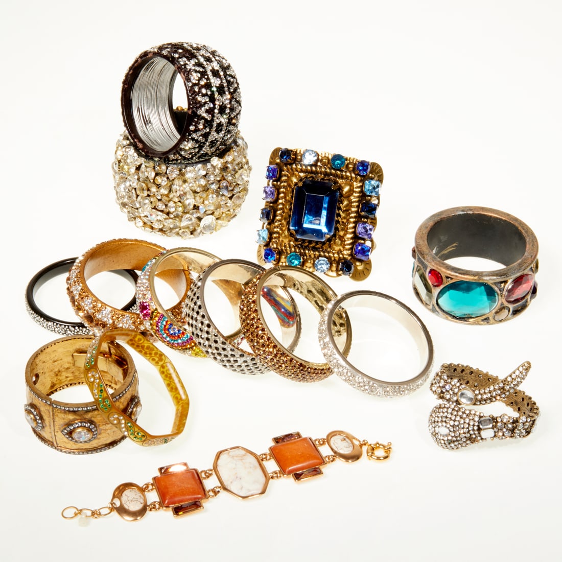 Selection of bedazzled bracelets: Selection of bedazzled bracelets, 21st c., (14) including bangles, cuffs and wraps of varying size and shape Provenance: The Iris Apfel Collection