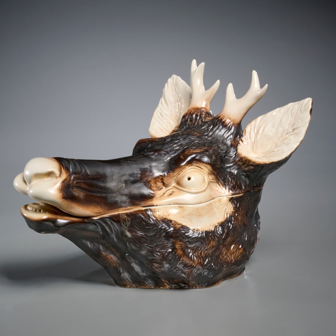 Mancioli porcelain stag's head tureen: Mancioli porcelain stag's head tureen, 20th c., Italy, naturalistically modeled with brown glaze, factory mark to underside, 11"h x 11"w x 14"d Provenance: The Iris Apfel Collection