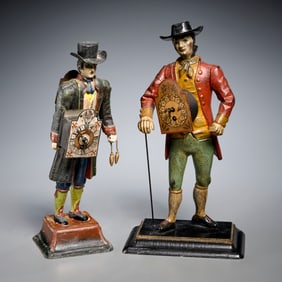 (2) Continental polychrome metal clock peddlers