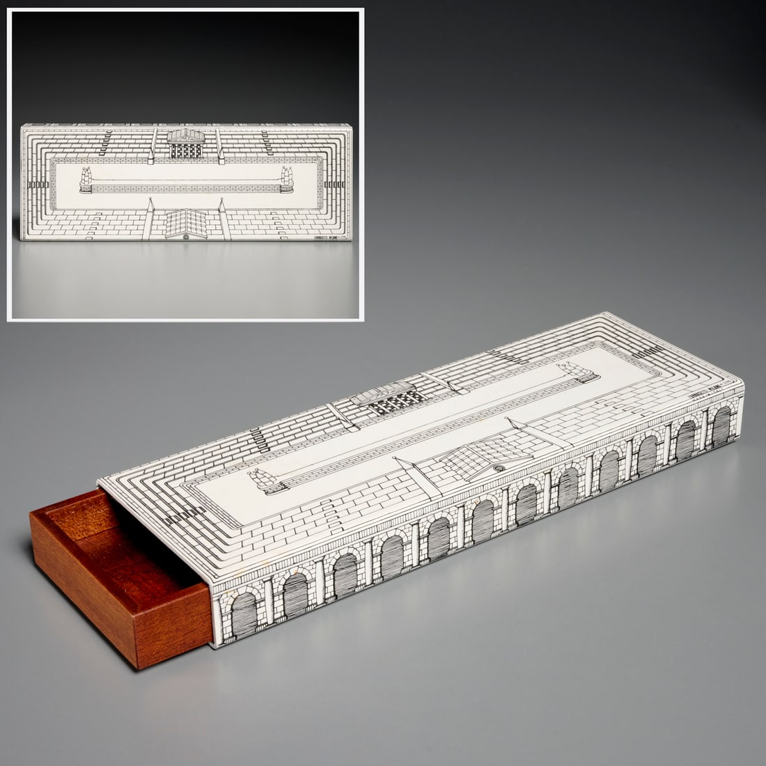 Fornasetti "Teatro Romano" enameled metal box: Fornasetti "Teatro Romano" enameled metal box, 20th c., Italy, with Khaya Senegalensis inner drawer, marked corner, 1.5"h x 12"l x 4"w Provenance: A Private Collection: Basking Ridge, NJ