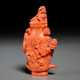 Chinese carved coral vase and cover