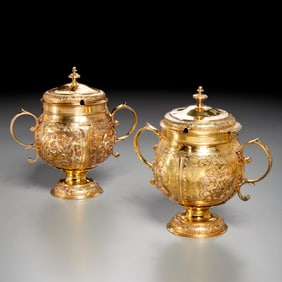 Near pair Victorian silver-gilt lidded cups
