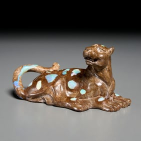 Carved raw opal model of a leopard