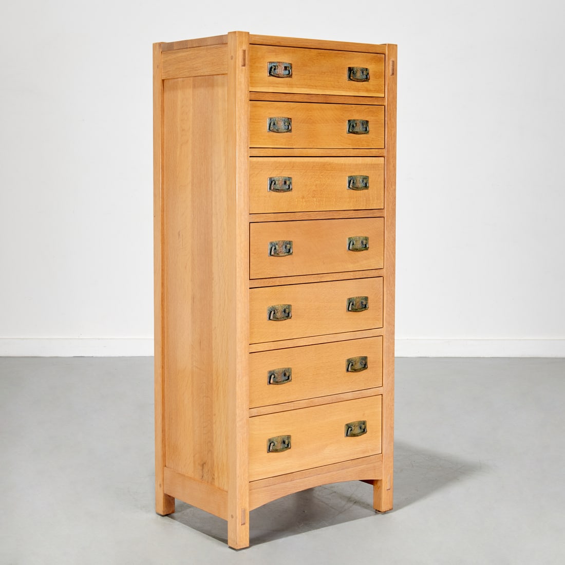 Stickley, oak lingerie chest: Stickley, oak lingerie chest, Late 20th/21st c., Manilus, NY, seven graduated drawers, copper pulls, exposed mortise-and-tenon joints, marked interior drawer, 53"h x 22"w x 16"d Provenance: A Private