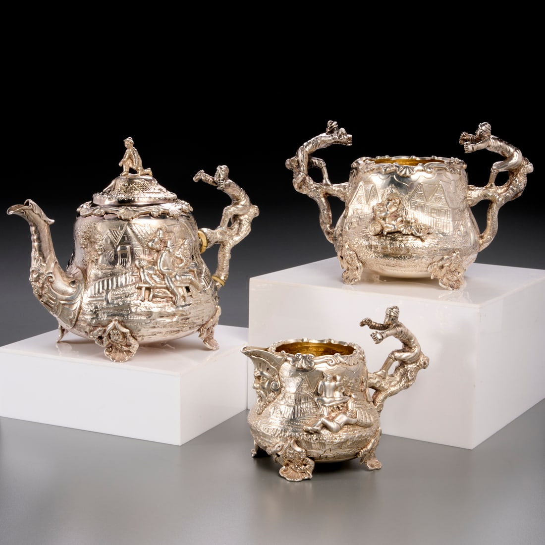 Unusual Victorian sterling "Temperence" tea set: Unusual Victorian sterling "Temperence" tea set, Letter dated 1875, London, maker's mark of Charles Stuart Harris, temperance movement inspired high relief decoration of townscapes and tavern scenes,