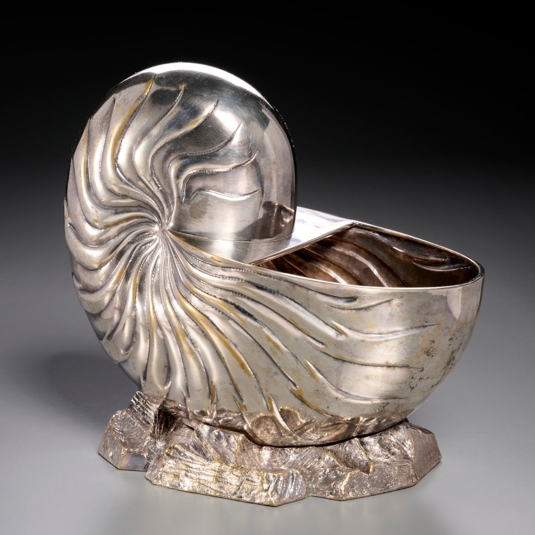 Rudolph Collection, silverplate shell wine cooler: Rudolph Collection, silverplate shell wine cooler, 20th c., nautilus shell on rock form base, marked lower edge, 11.5"h x 13"w x 7.5"d Provenance: A Private Collection: 1040 Fifth Avenue, NYC