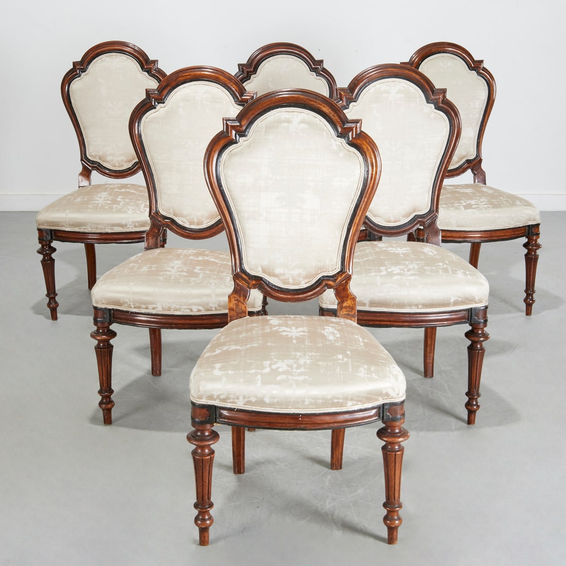 Set (6) North Italian ebonized walnut side chairs: Set (6) North Italian ebonized walnut side chairs, 19th c., in the Renaissance Revival taste, molded cartouche-shaped backrests, raised on turned and fluted legs, silver fabric upholstery, each 40.5"h